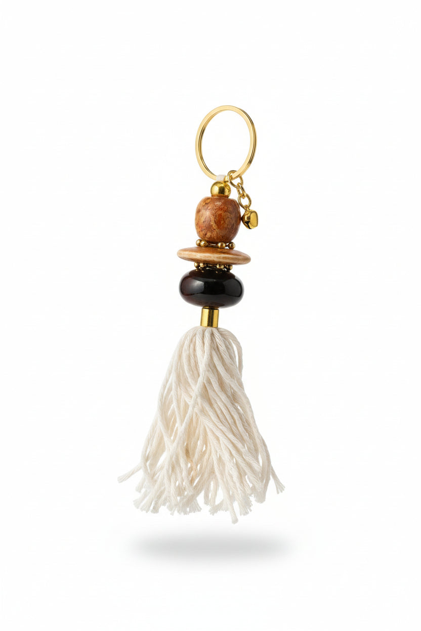 Keychain with beads and a tassel on a neutral background