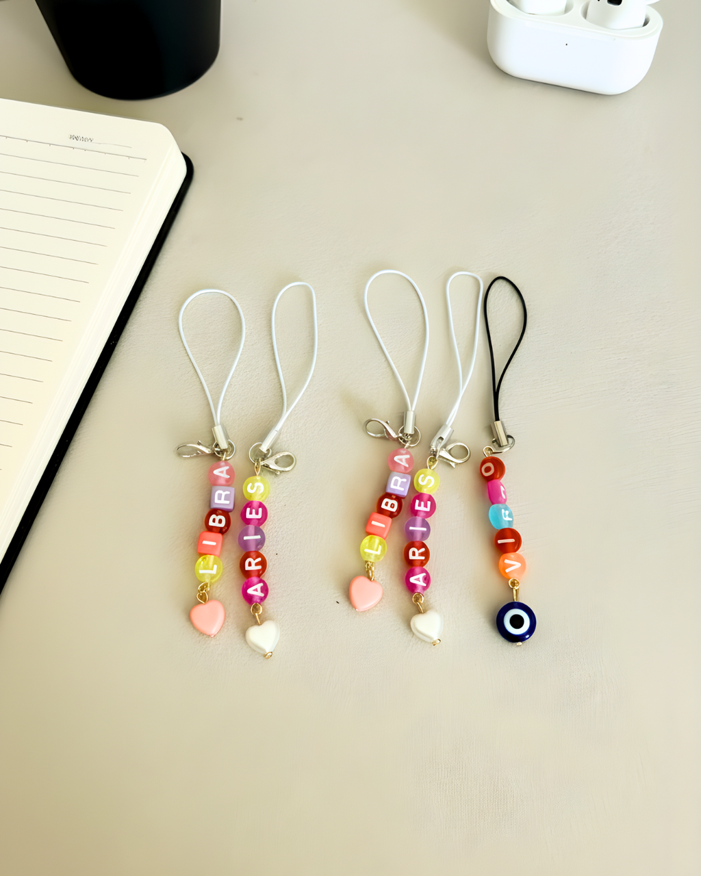 Zodiac phone charm with a heart charm