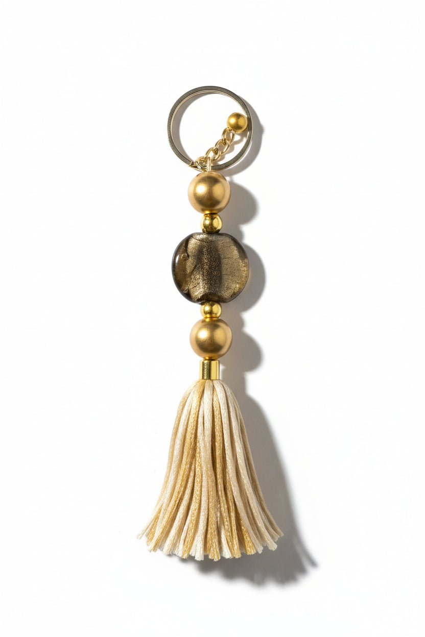Keychain with beads and tassel on a neutral background