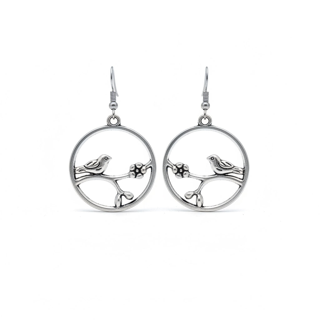 Humming bird on a branch silver