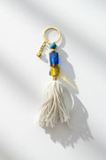 Keychain with beads and tassel on a white background